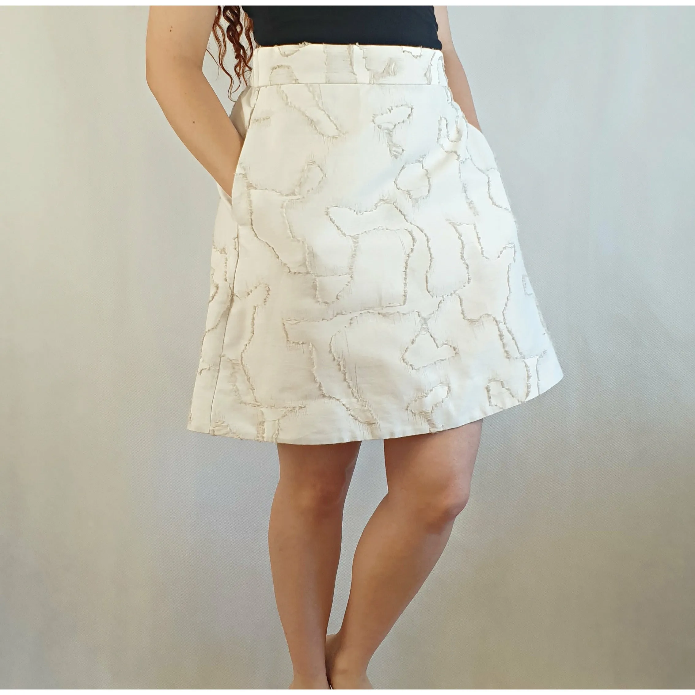 Cos cream coloured skirt with unique freyed pattern size S (best fits size 10)